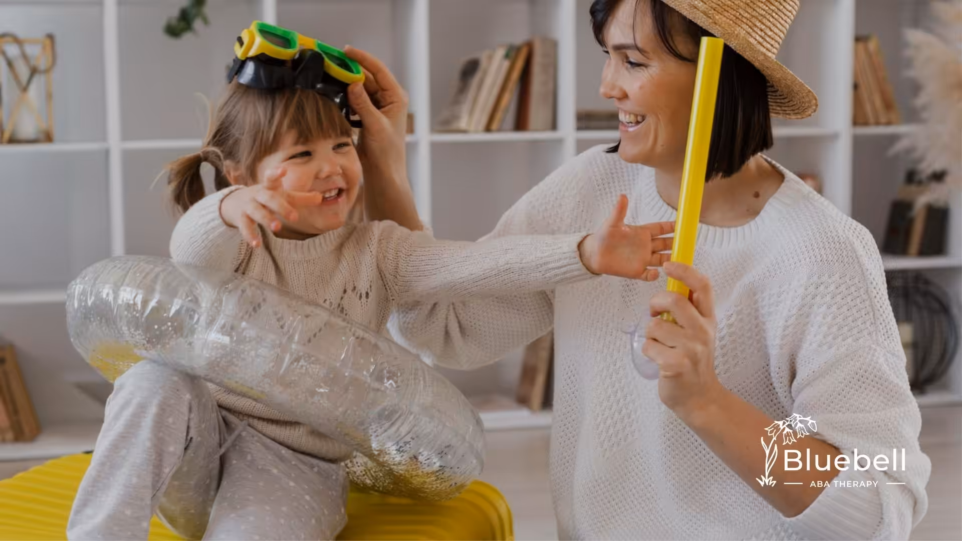 ABA therapist engaging a young child in a playful ABA therapy session using imaginative props.