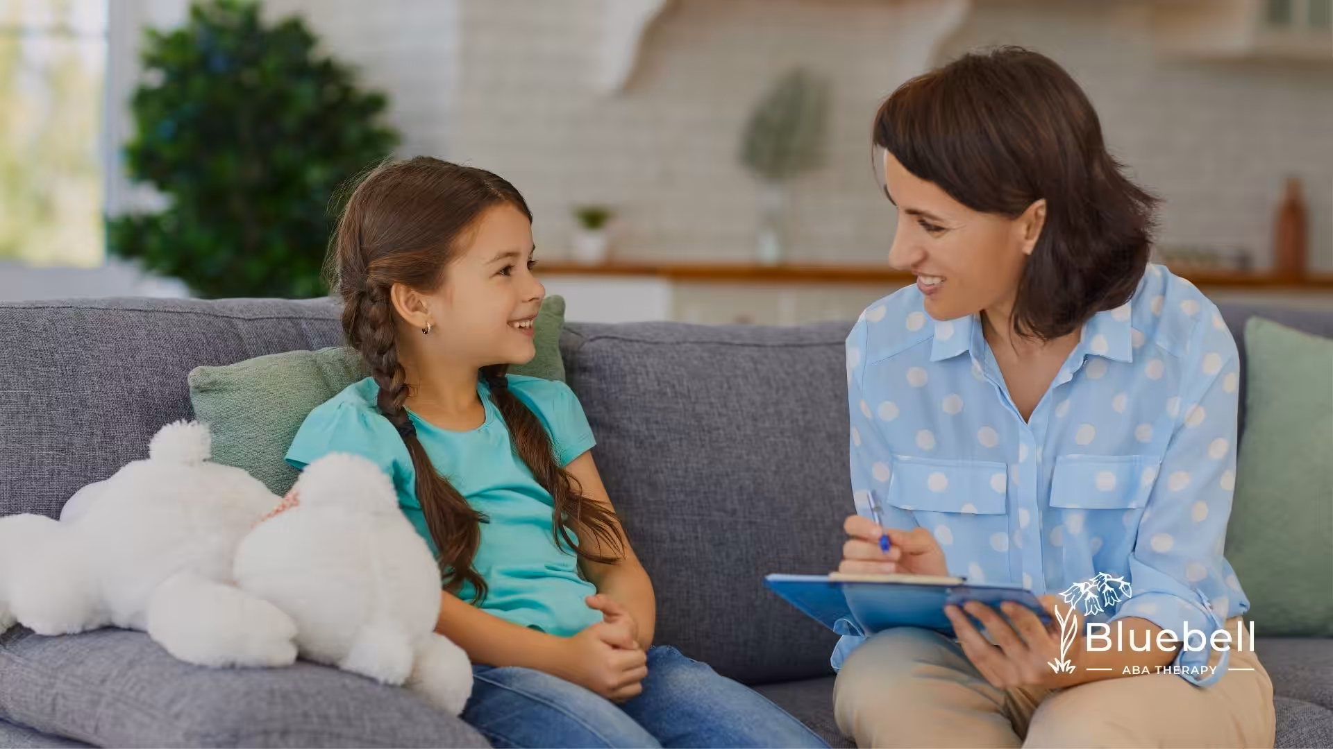 A woman therapist doing ABA at home with a child