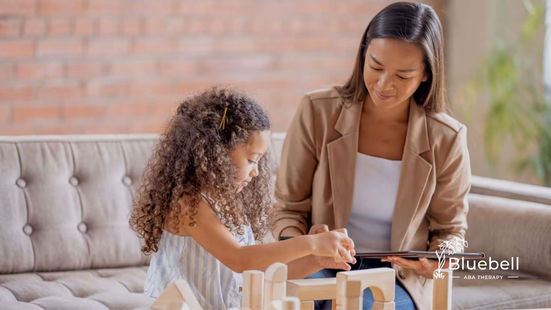 a young girl with a teacher in aba theraphy session