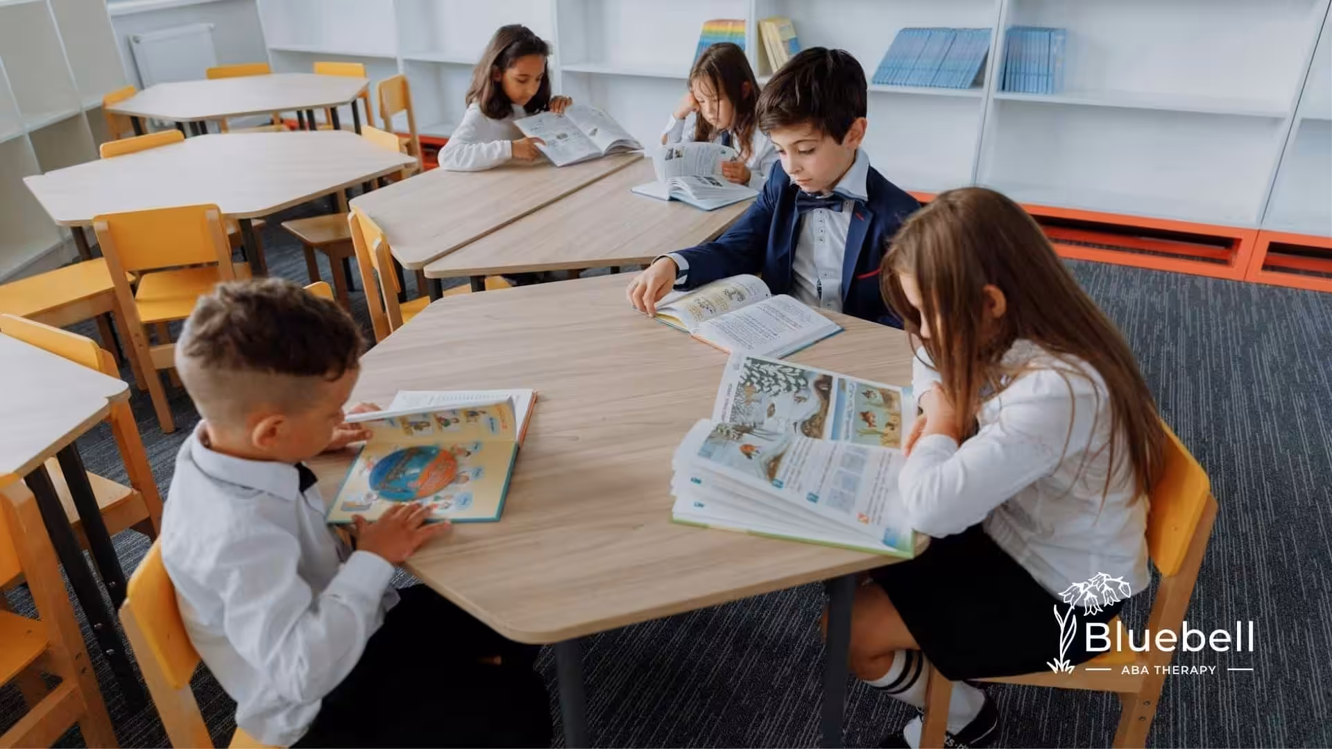 Children with autism focused on reading books around a table at a school library in North Carolina.