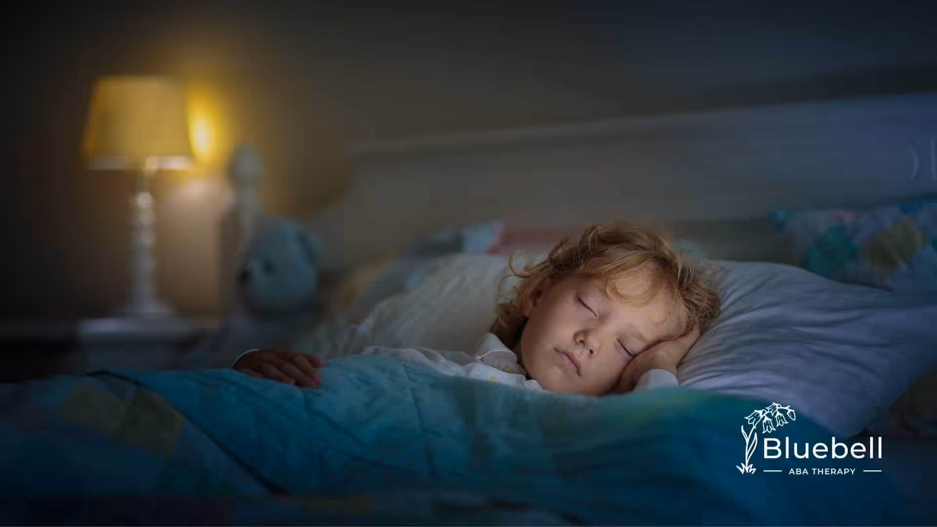 A little boy sleeping alone.