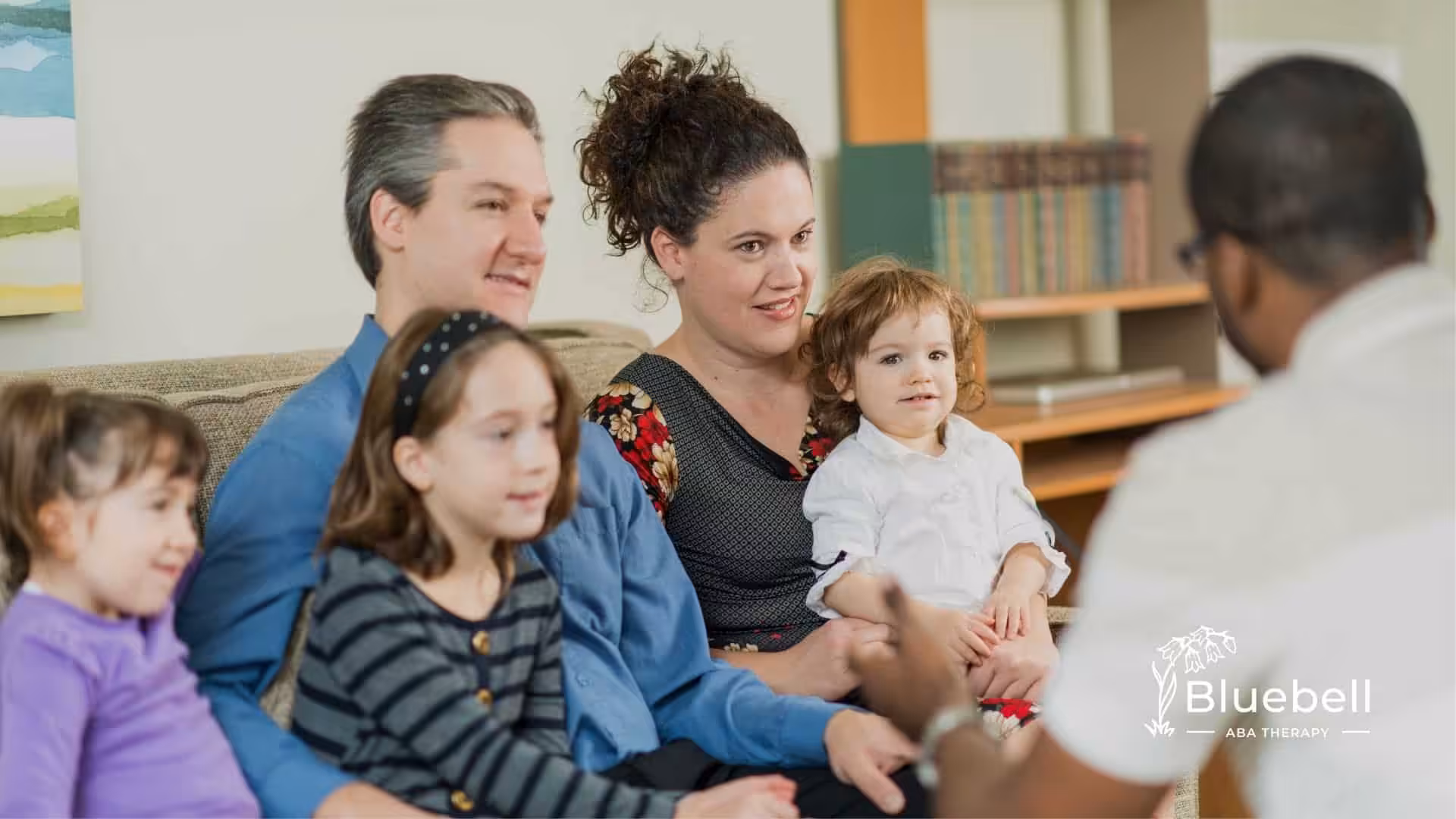A family consulting about choosing ABA therapy or preschool.