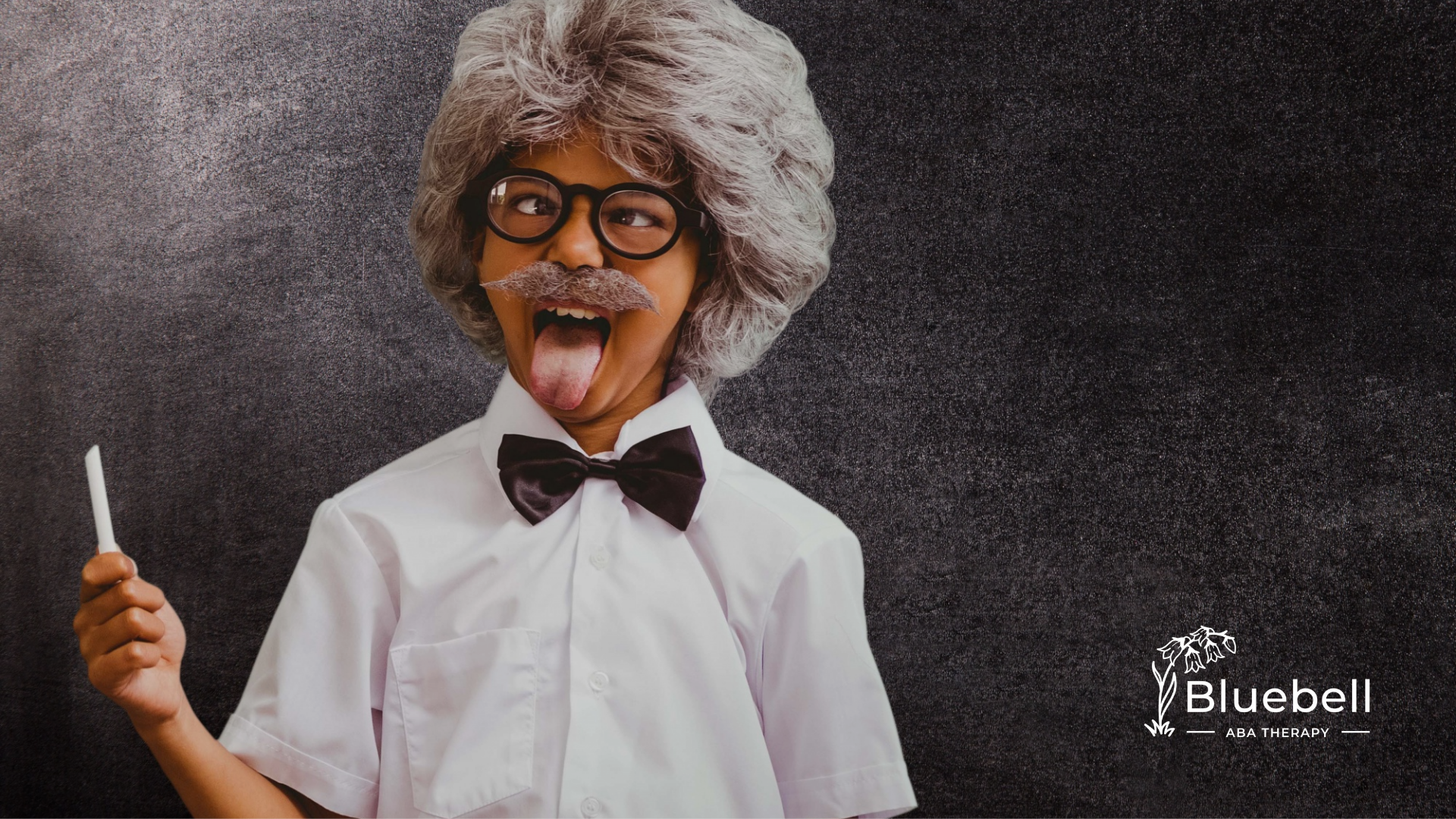 A kid wearing his Albert Einstein costume