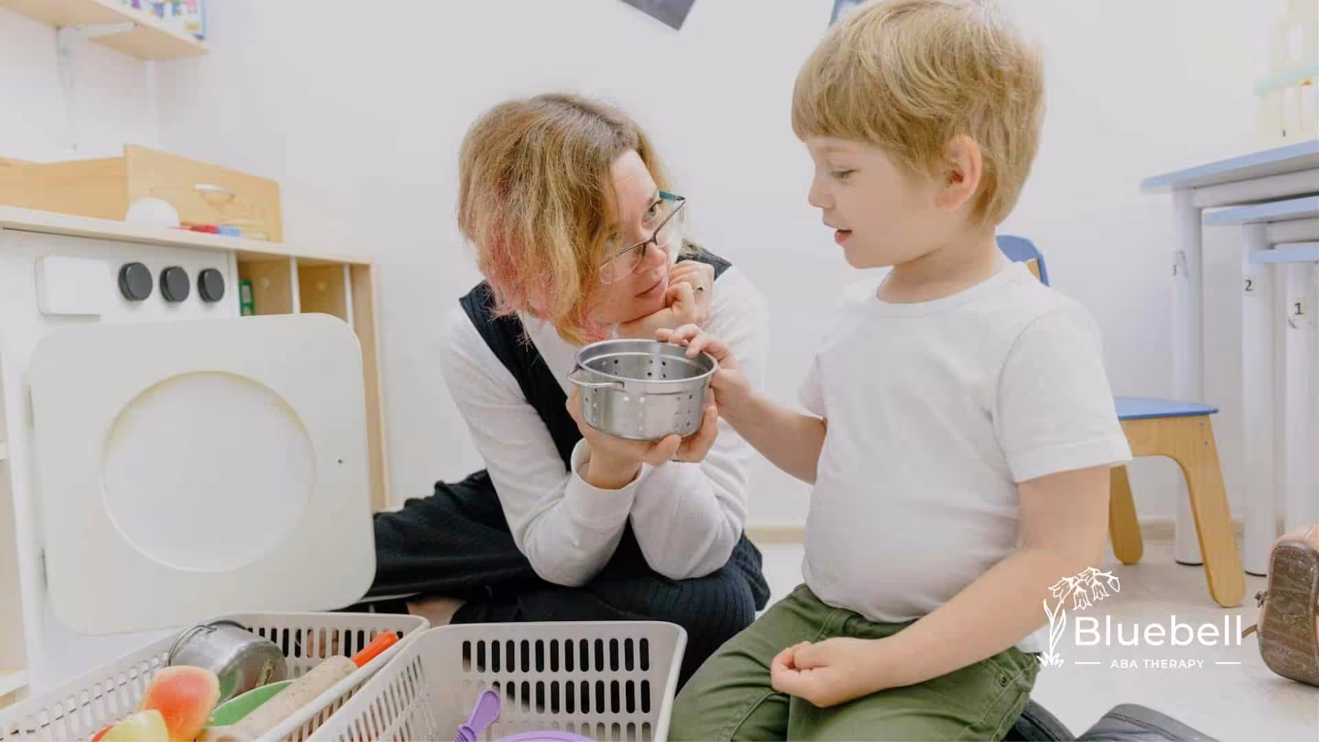A BCaBA interacting with an autistic boy in a play-based learning environment in North Carolina.