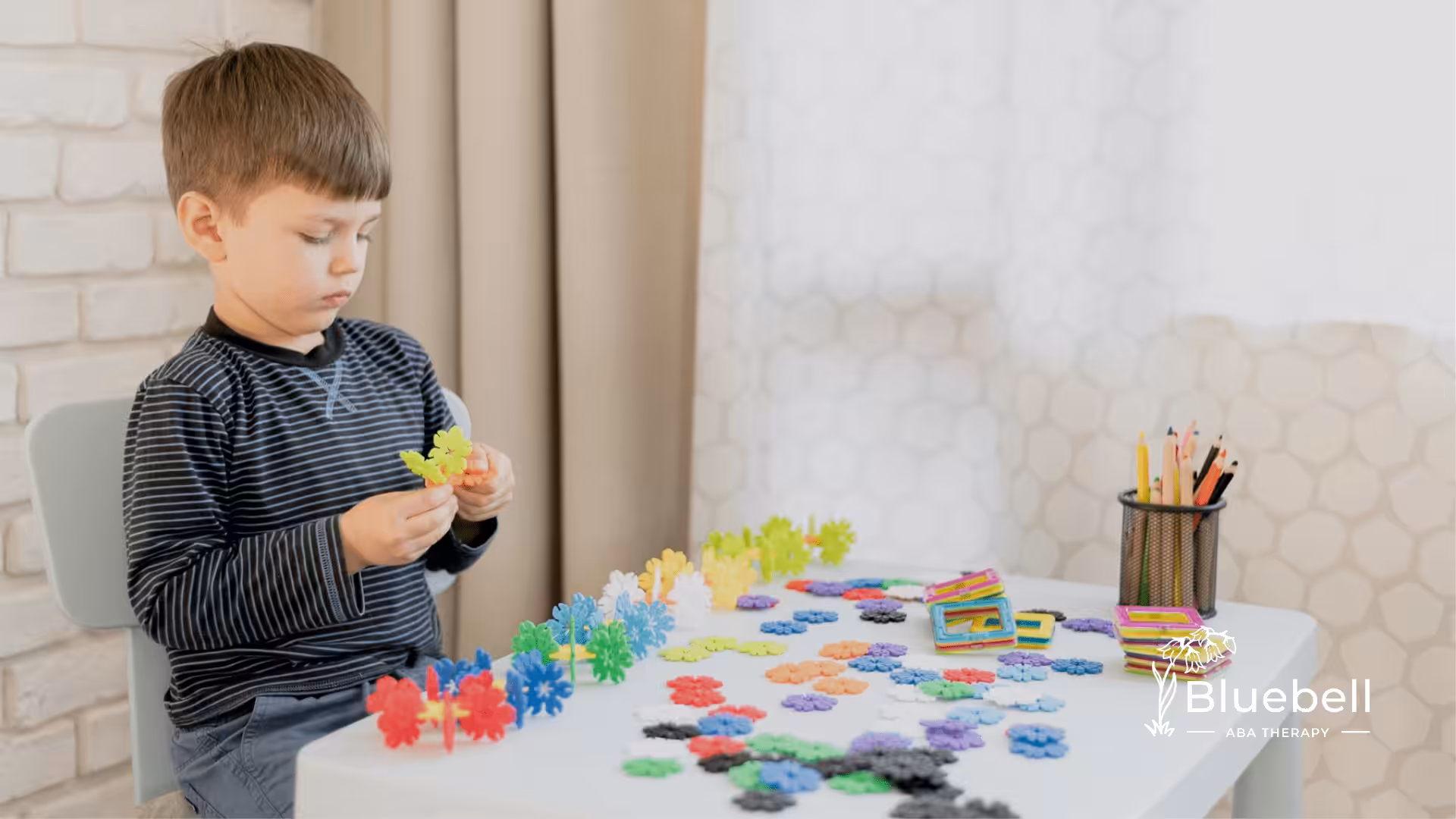 A child with autism playing on a table