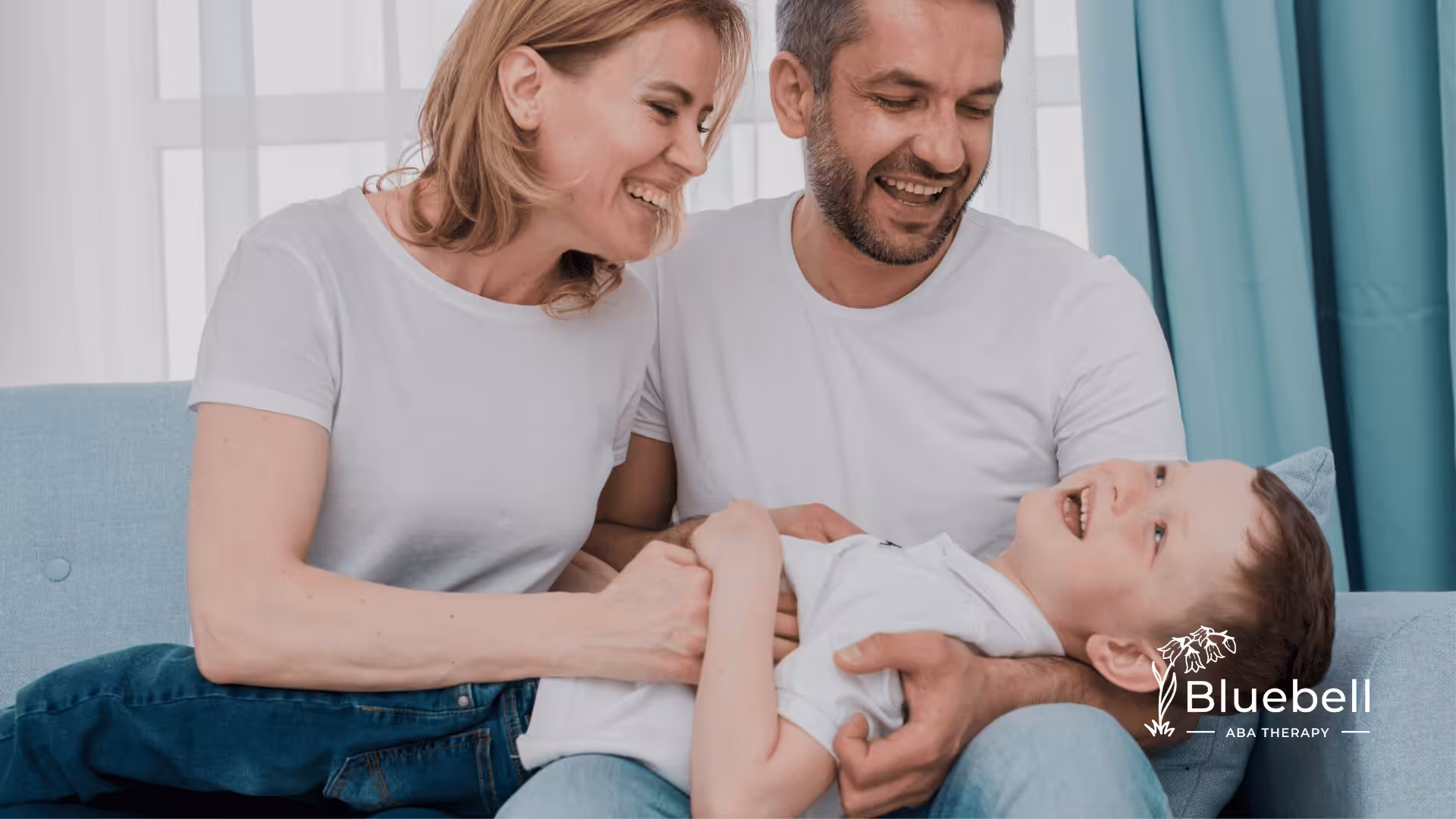 A mother and a father playing with their autistic child