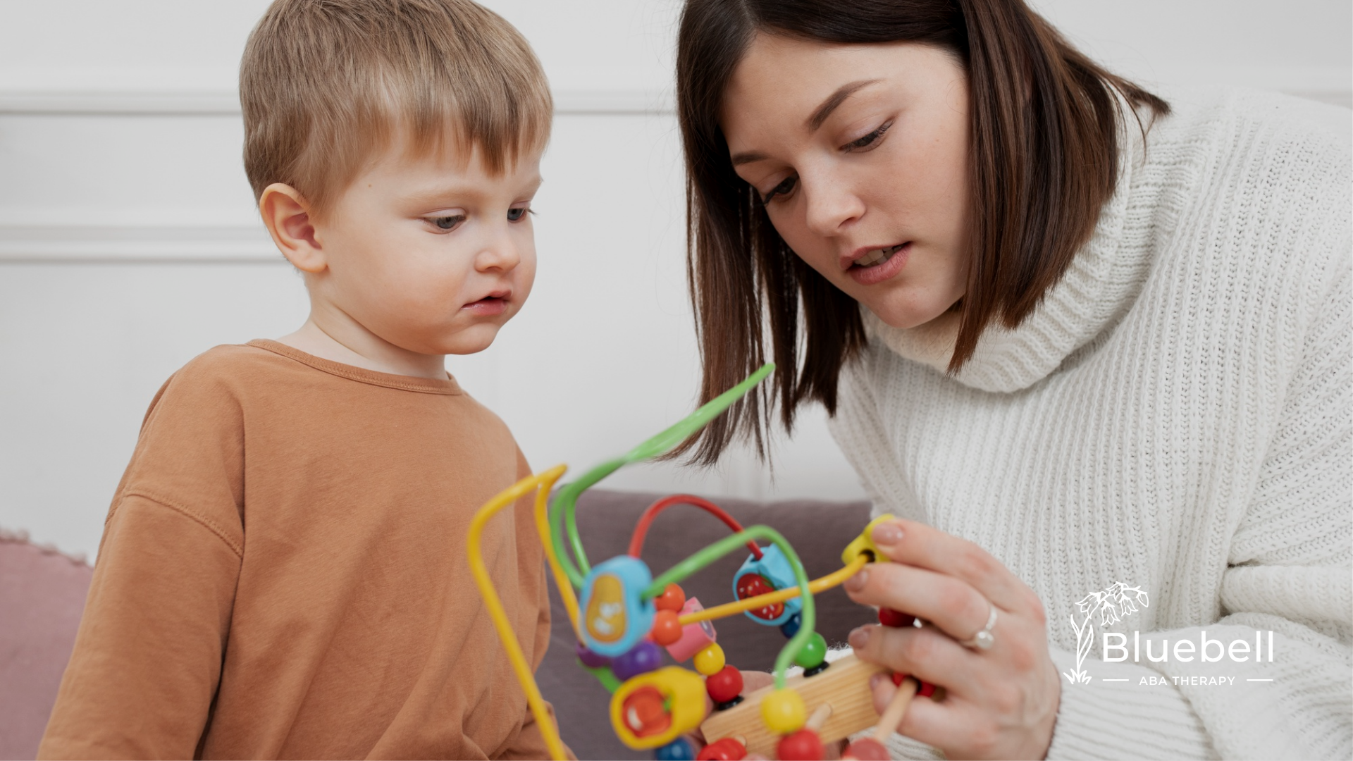 An RBT and a boy with autism during ABA therapy