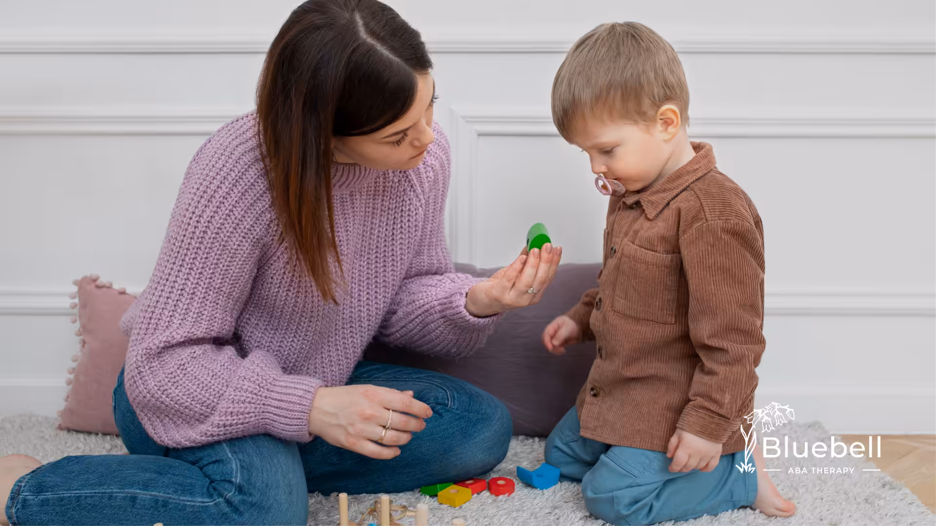 A child and an ABA therapist during ABA therapy