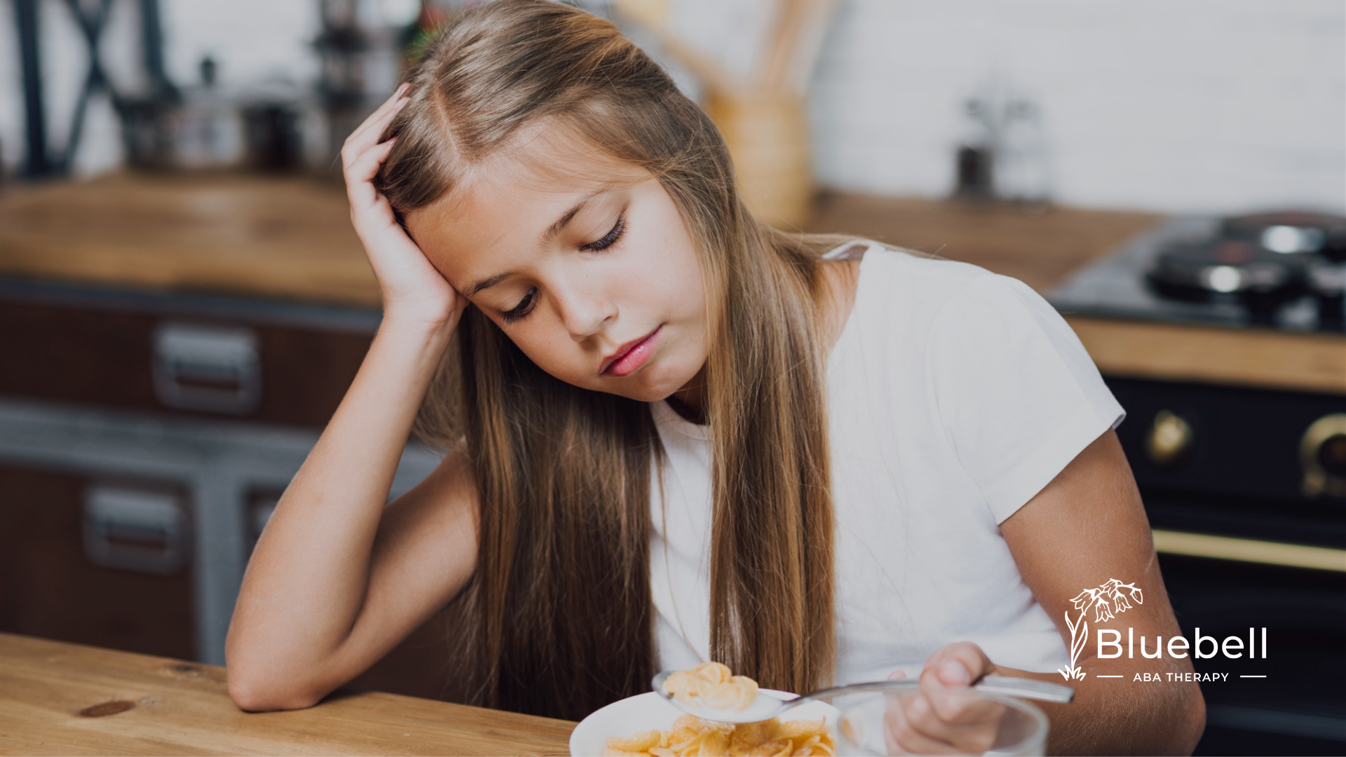 A child looking overstimulated while eating