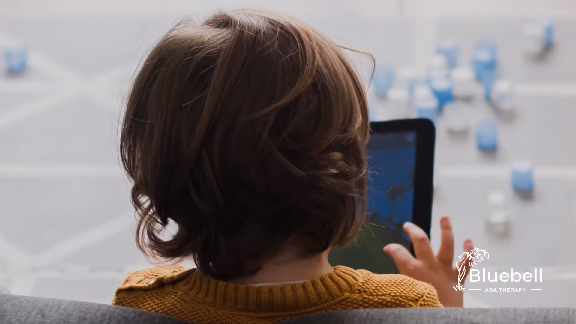 A child is using an iPad