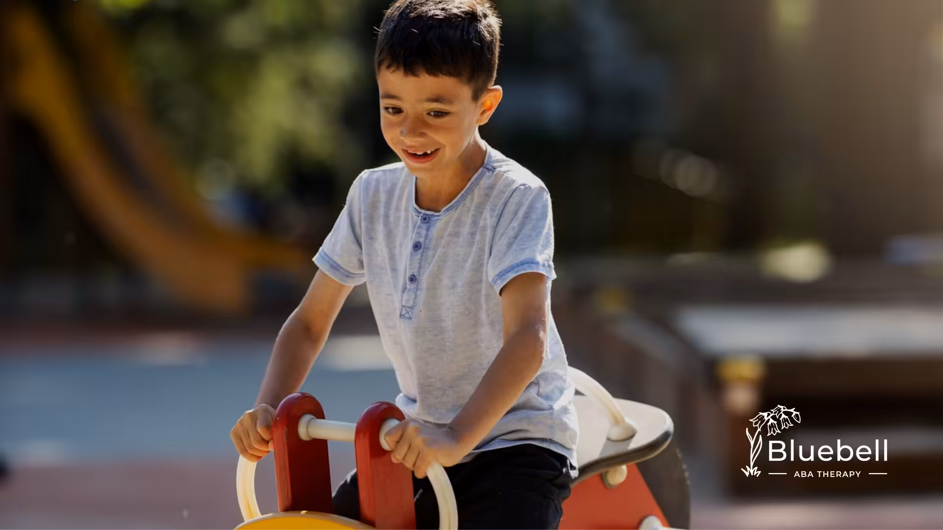 A kid with autism playing in a playground