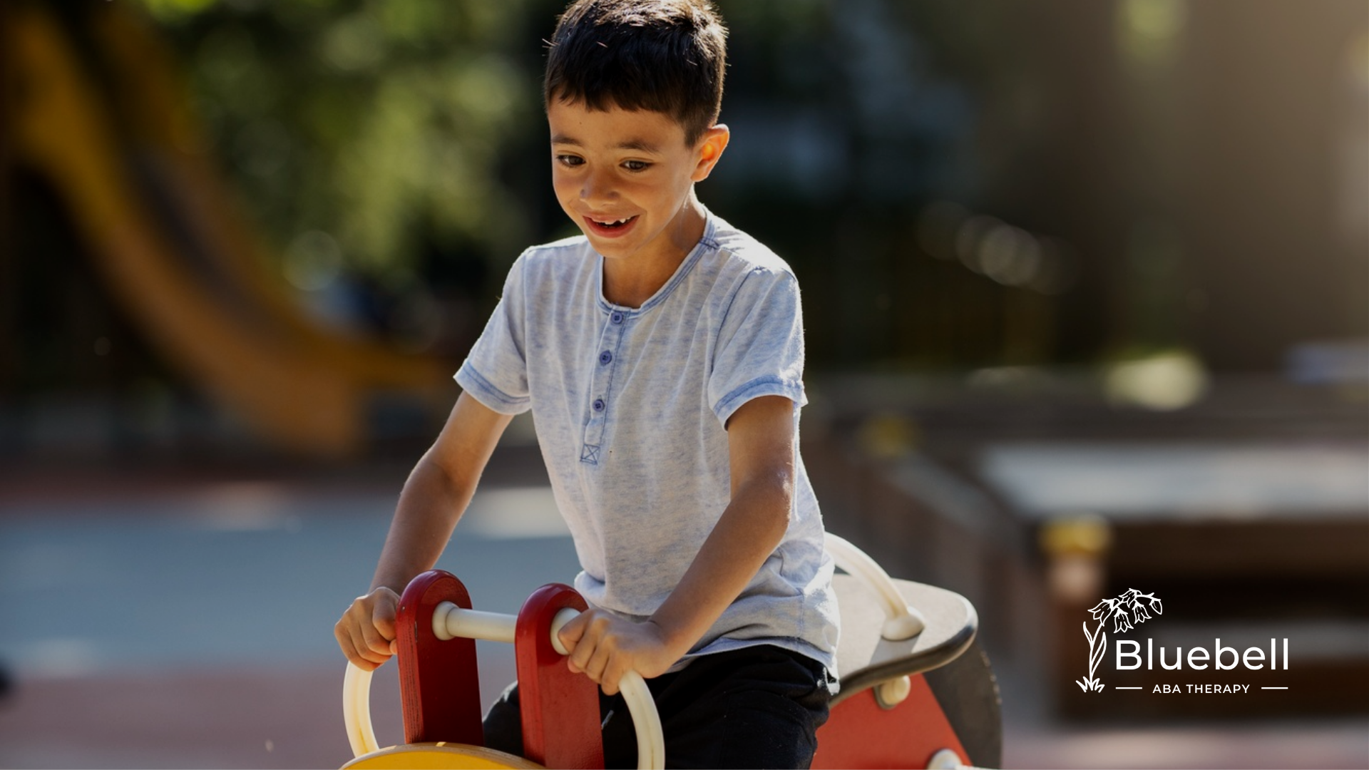 A kid with autism playing in a playground