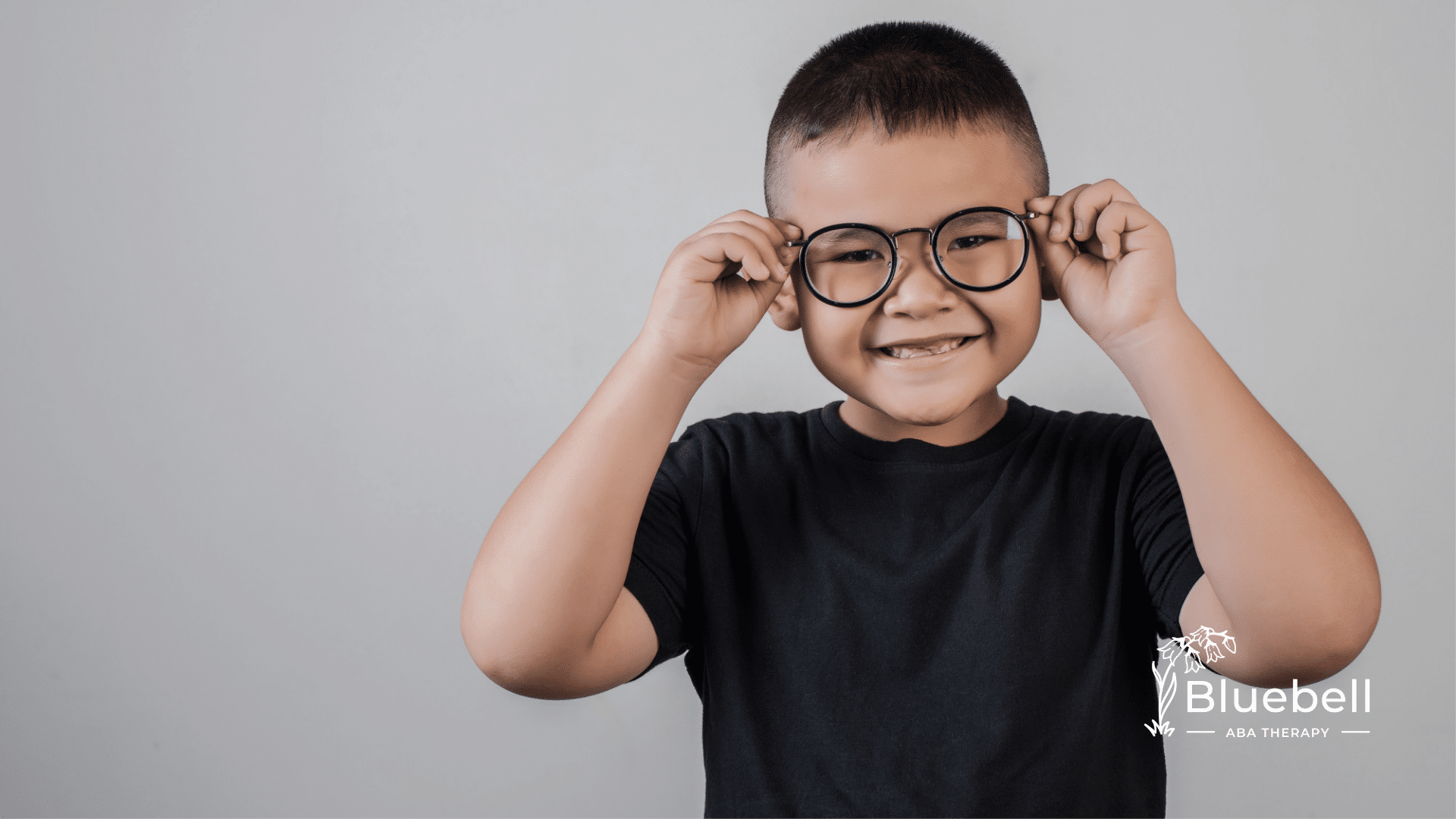 A child with autism wearing eyeglasses