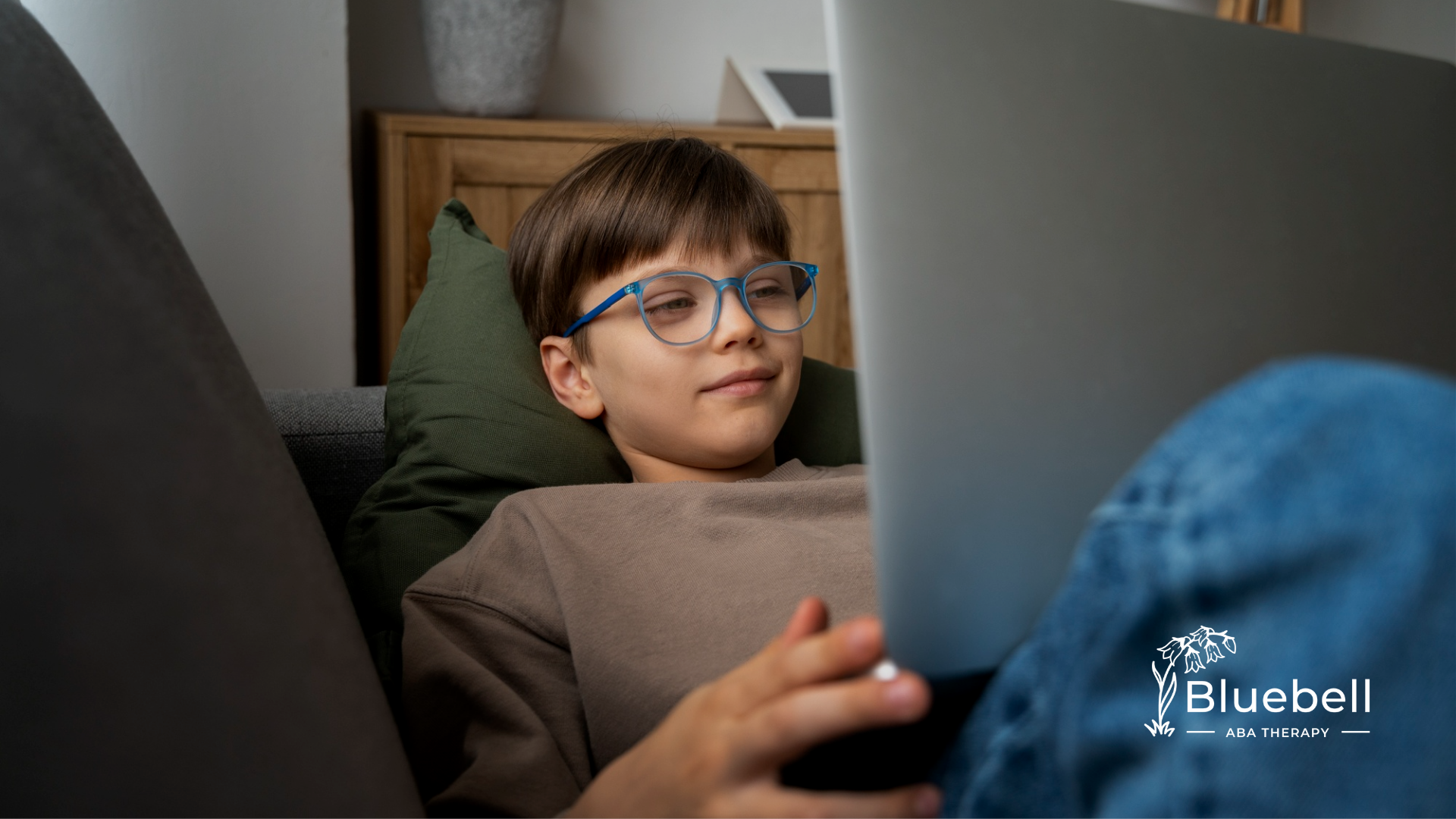 A kid taking an online autism test using a laptop