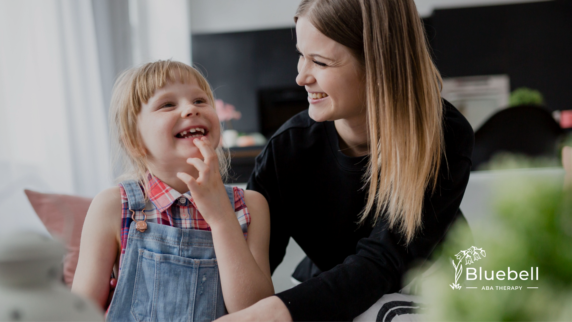 A mother laughing with her child with special needs
