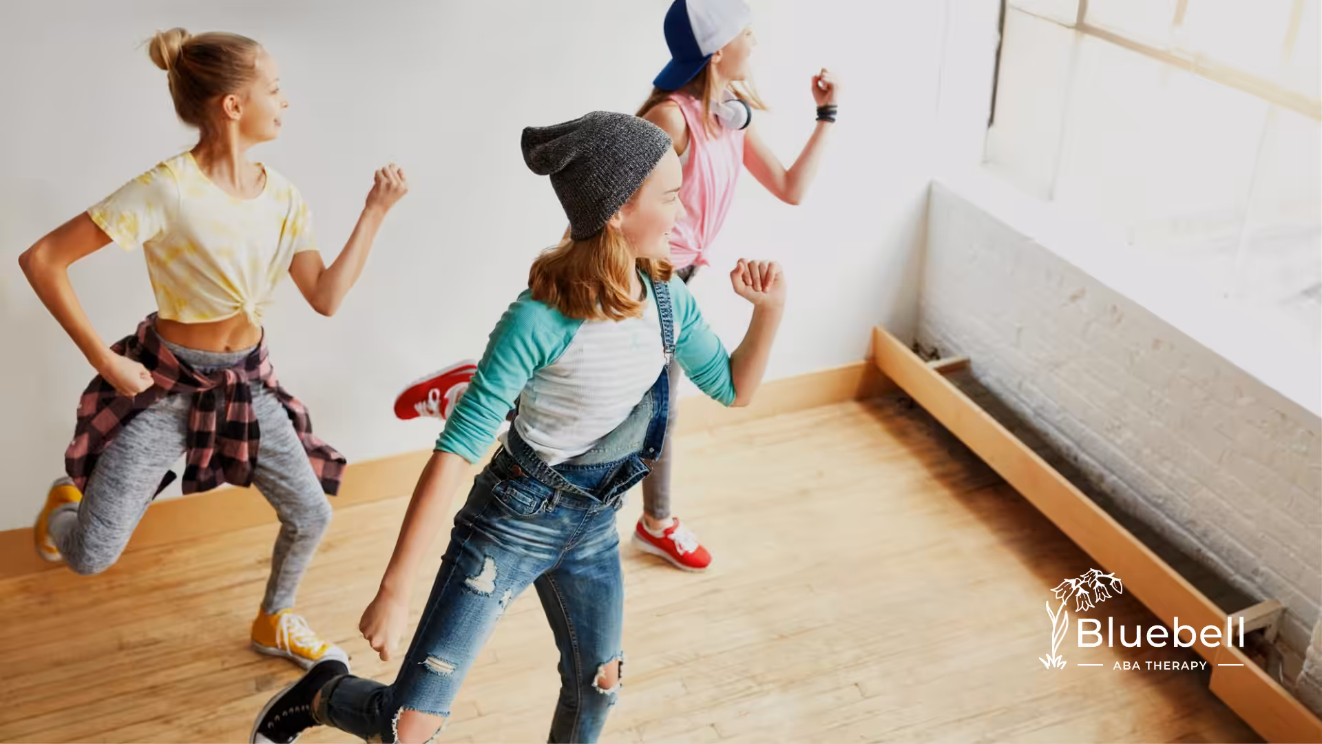 A group of kids dancing in a room