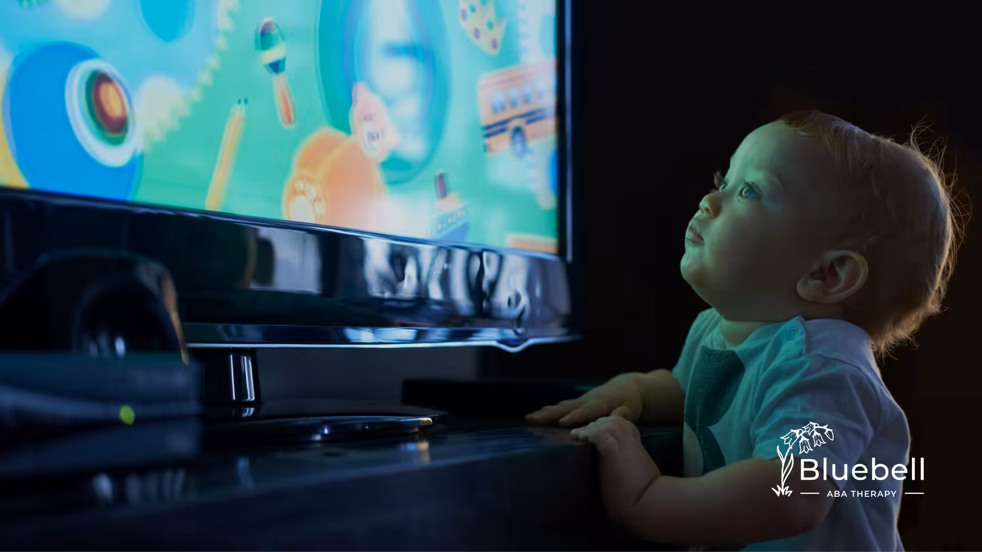 A toddler watching TV
