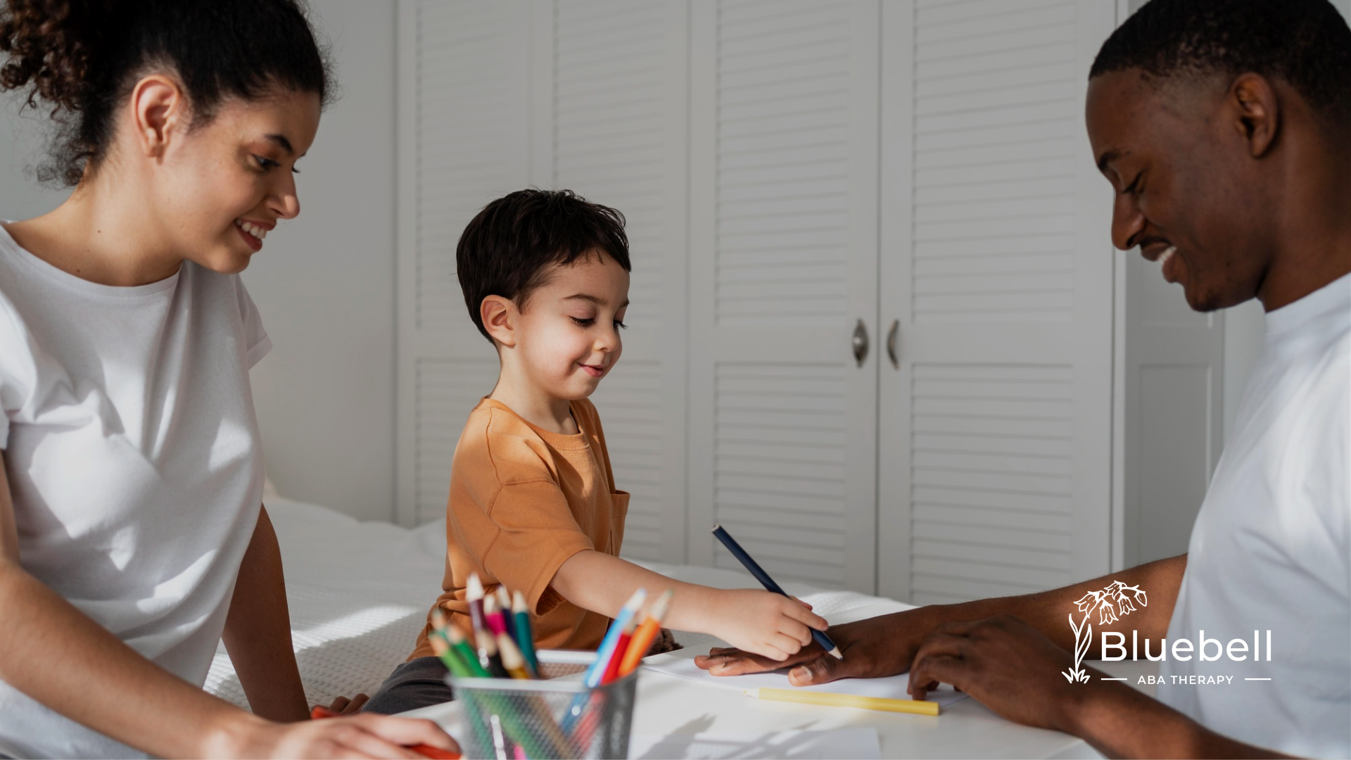 Parents helping their child through ABA hterapy