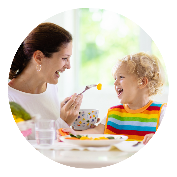 child/therapist feeding bluebell aba therapy